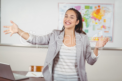 Pretty teacher teaching in a classroom