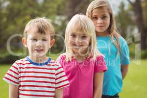 Smiling classmates looking at camera