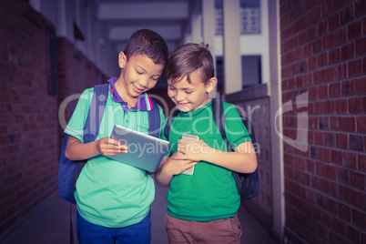 Students using a tablet and smart phone