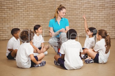 Students sitting and listening to the teacher