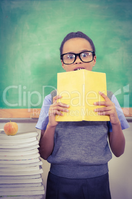 Shocked student holding a book