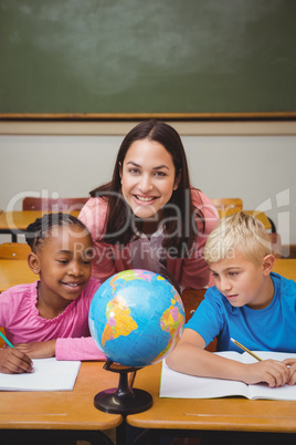 Teacher sitting with her students