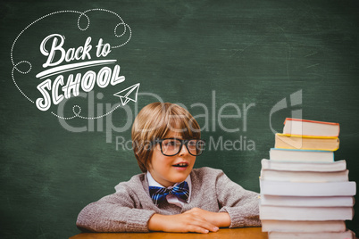 Composite image of cute pupil with pile of books