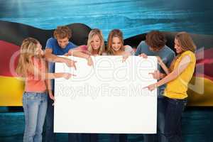 Composite image of a group holding a blank sheet and pointing to