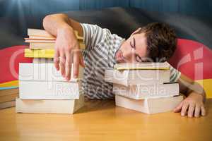 Composite image of student asleep in the library