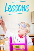 Lessons against cute pupil dressed up as scientist in classroom