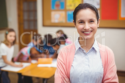 Teacher smiling at camera in classroom