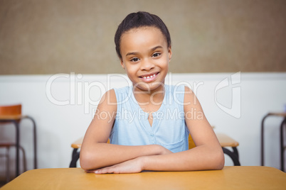 Smiling student sitting at a desk