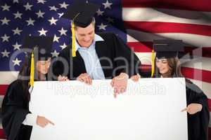 Composite image of three graduates pointing to the blank sign