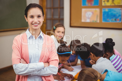 Teacher smiling at camera in classroom