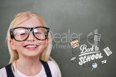 Composite image of cute pupil smiling