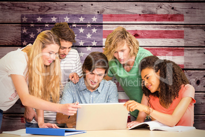 Composite image of college students using laptop in library