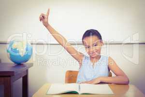 Smiling student with a rasied hand