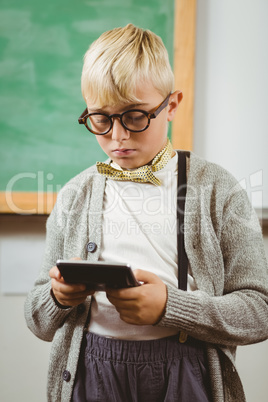 Pupil dressed up as teacher using calculator