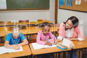 Teacher sitting with her students