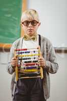 Pupil dressed up as teacher holding abacus