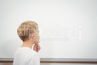 Puzzled student looking at whiteboard