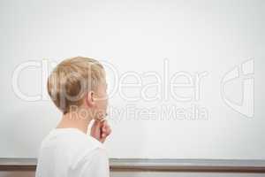 Puzzled student looking at whiteboard