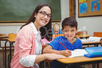 Happy teacher helping her students