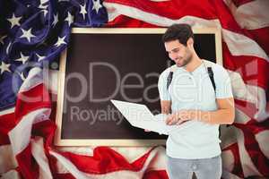 Composite image of student using laptop