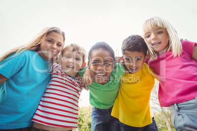 Smiling classmates with arms around each other