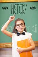 History against cute pupil dressed up as teacher in classroom