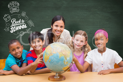 Composite image of cute pupils and teacher looking at globe in l