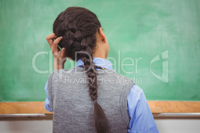 Puzzled student scratching their head