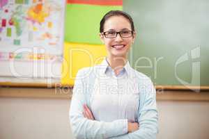 Teacher smiling at camera in classroom