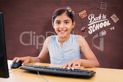 Composite image of school kid on computer