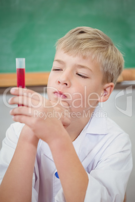 Student using a microscope and chemistry set