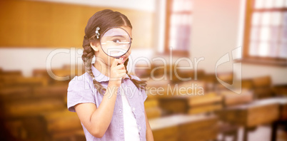 Composite image of pupil looking through magnifying glass