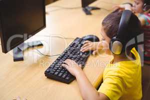 Cute pupil in computer class