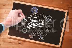 Composite image of hand writing with a white chalk