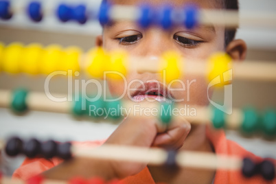 Student using a maths abacus