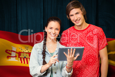 Composite image of smiling classmates with tablet pc