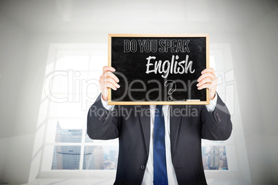 Composite image of businessman showing board