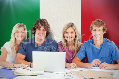 Composite image of a group of students with a laptop look into t