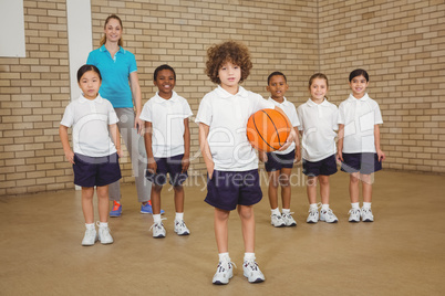 Students together about to play basketball