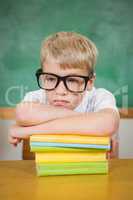 Upset student resting on books