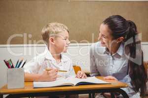 Teacher helping a student in class