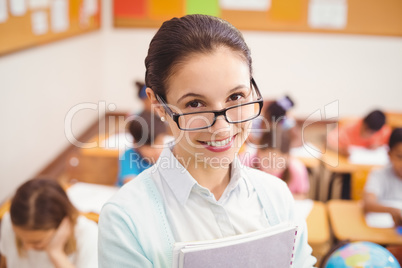 Teacher smiling at camera in classroom