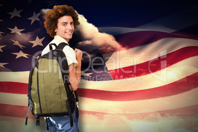 Composite image of casual young man in office corridor