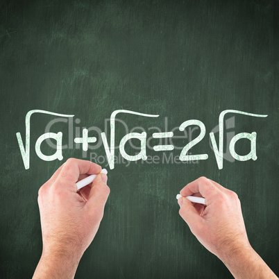 Composite image of hand writing with chalk