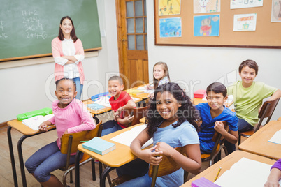 Students and teacher looking at the camera