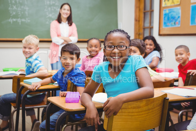 Students and teacher looking at the camera