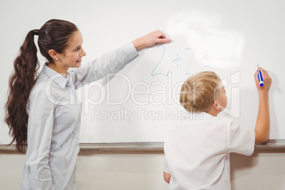 Teacher helping a student in class