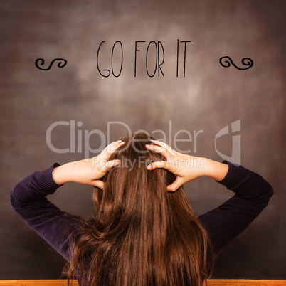 Go for it! against confused pupil looking at chalkboard