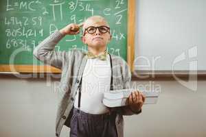 Pupil dressed up as teacher holding books