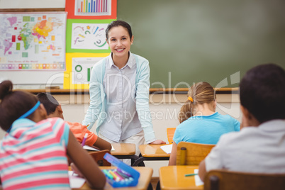 Pupils smiling at camera during class Pupils smiling at camera during class